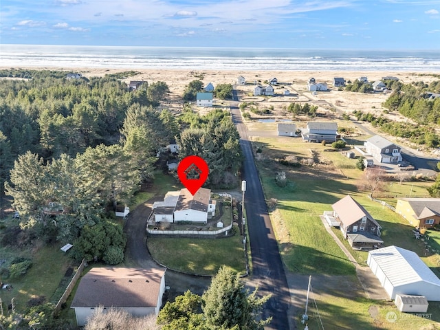 aerial view with a water view and a view of the beach