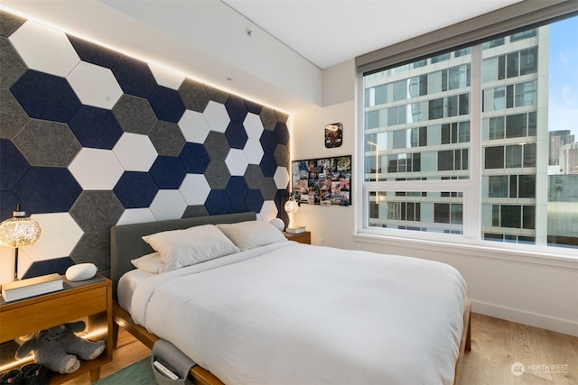 bedroom featuring hardwood / wood-style floors