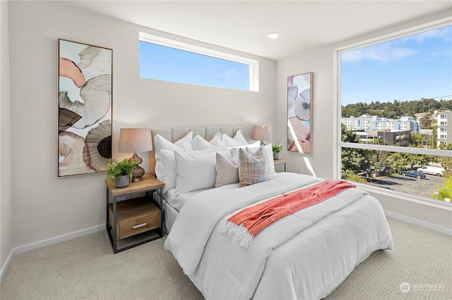 bedroom featuring light colored carpet