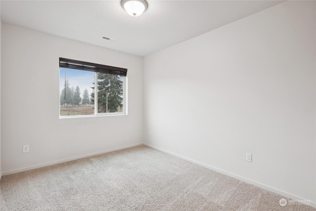 unfurnished room featuring carpet flooring