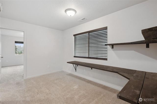 interior space with a textured ceiling