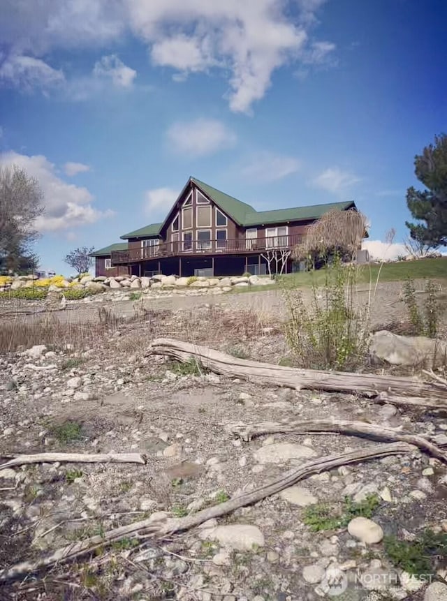 back of house featuring a deck