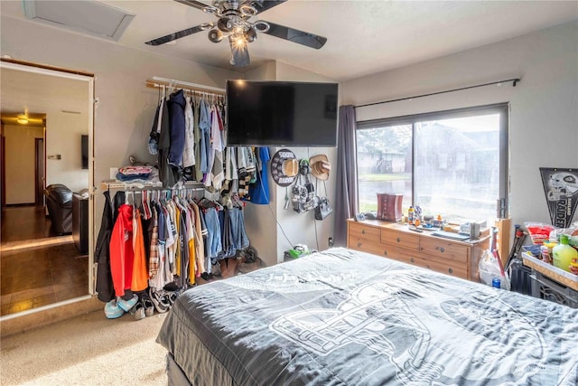 carpeted bedroom with ceiling fan and a closet