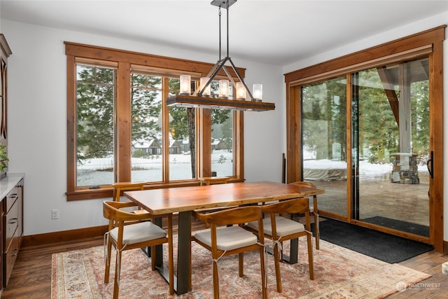 dining space with light wood-type flooring