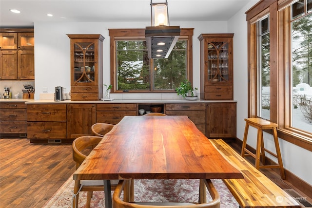 dining area featuring hardwood / wood-style flooring and a wealth of natural light