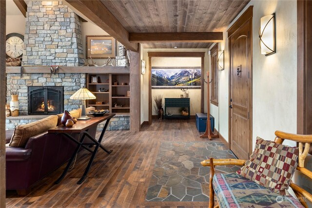 interior space with dark hardwood / wood-style flooring, beamed ceiling, and wood ceiling