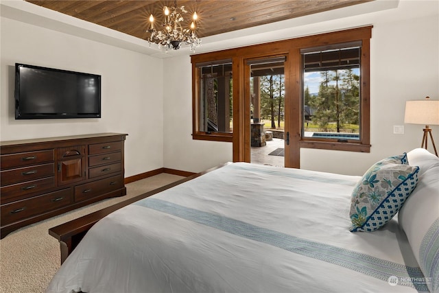 carpeted bedroom featuring a chandelier, access to exterior, wood ceiling, and a tray ceiling