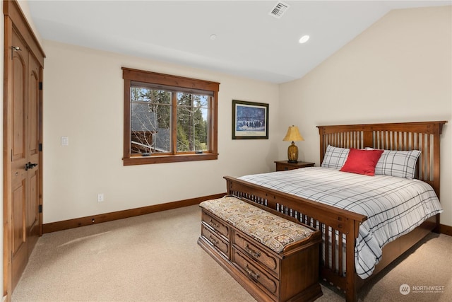 bedroom with carpet and lofted ceiling