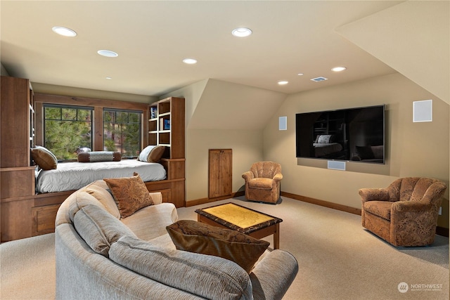 carpeted living room with lofted ceiling