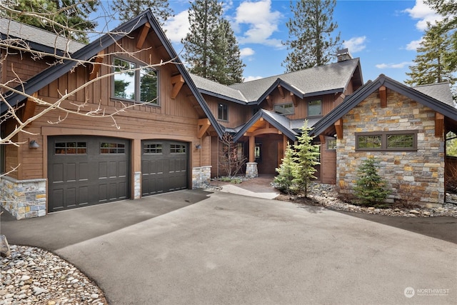 view of front of property featuring a wall mounted air conditioner and a garage