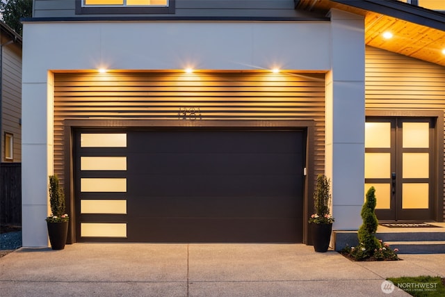 garage with concrete driveway