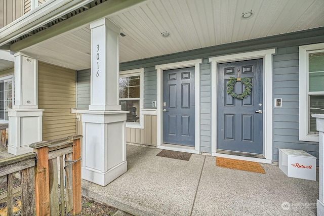 doorway to property with a porch