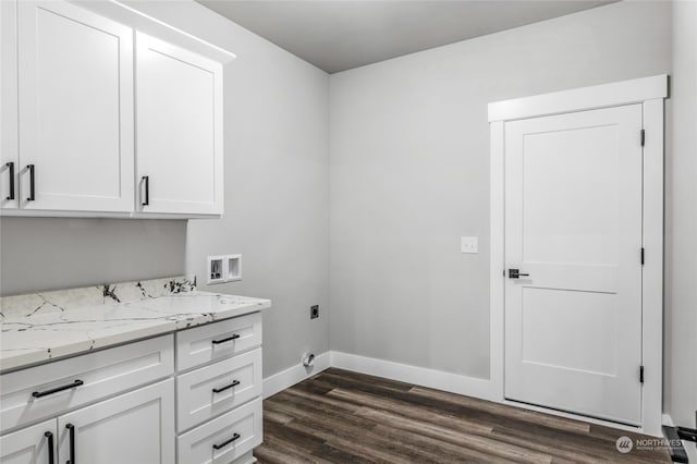 laundry room with hookup for an electric dryer, dark hardwood / wood-style flooring, cabinets, and washer hookup