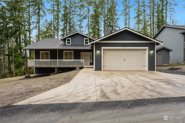 view of front of house with a porch and a garage