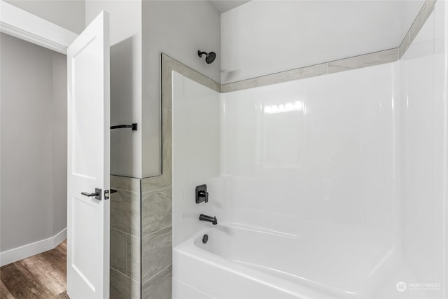 bathroom featuring shower / bathing tub combination and wood-type flooring