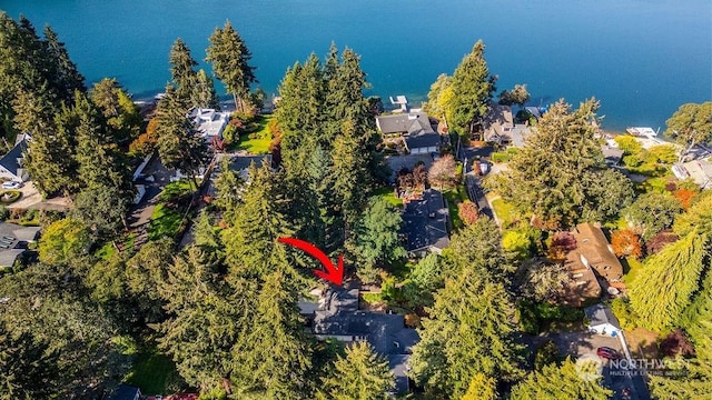 birds eye view of property featuring a water view