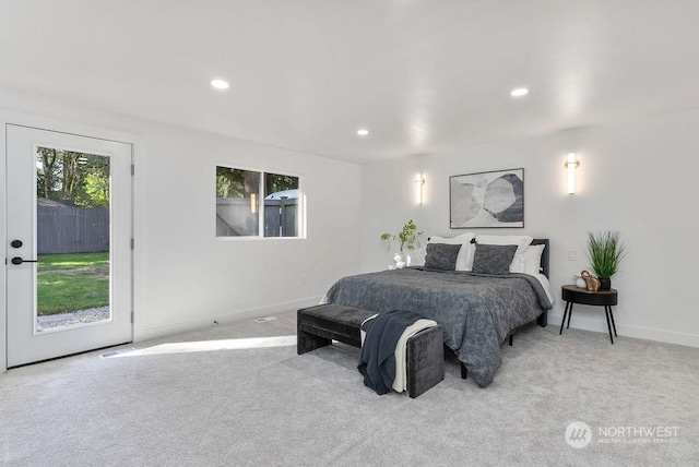 bedroom featuring access to outside and light carpet