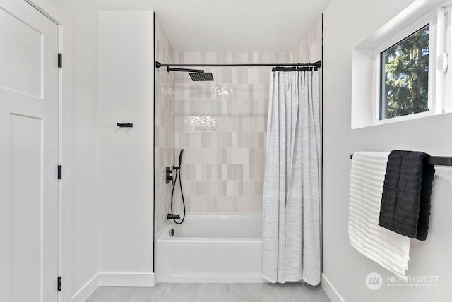 bathroom with shower / tub combo with curtain