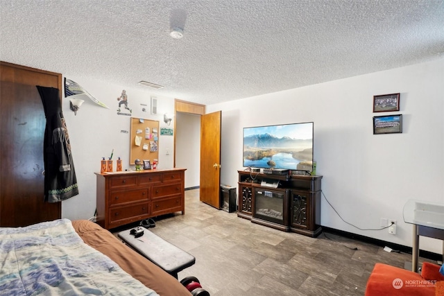 bedroom featuring a textured ceiling