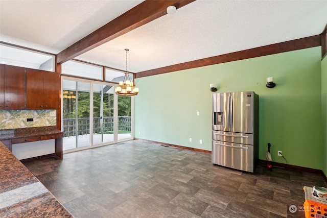 kitchen with stainless steel refrigerator with ice dispenser, decorative backsplash, beamed ceiling, a wall of windows, and a chandelier