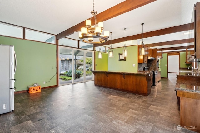 reception area featuring an inviting chandelier