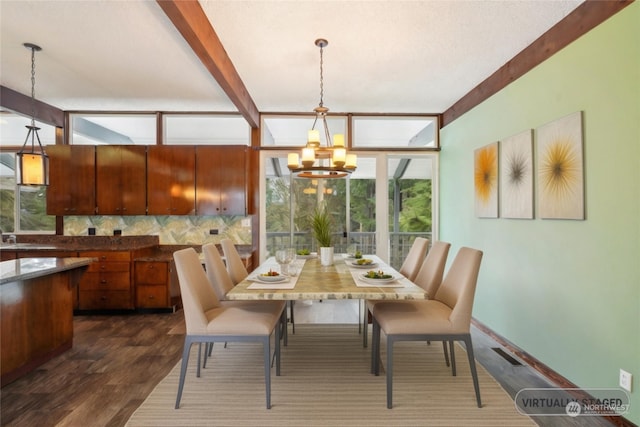 dining area featuring a healthy amount of sunlight, dark hardwood / wood-style flooring, beamed ceiling, and a chandelier