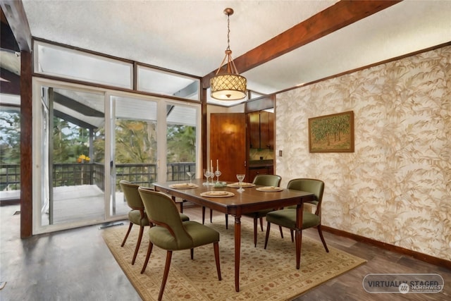 dining area with dark wood-type flooring and beamed ceiling