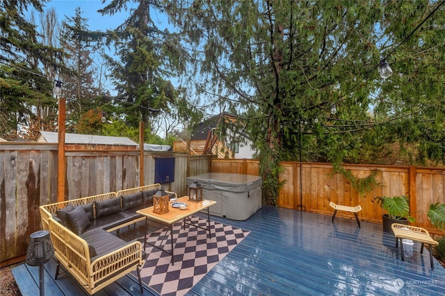 deck featuring outdoor lounge area and a hot tub