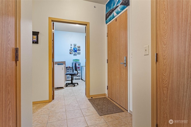 corridor with light tile patterned floors