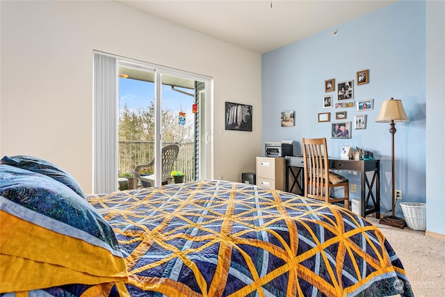 bedroom featuring access to exterior and carpet