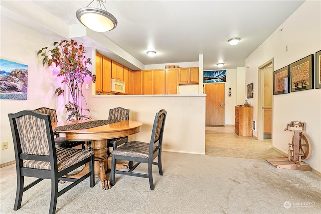 view of carpeted dining room