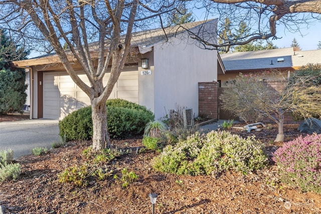 view of property exterior featuring a garage