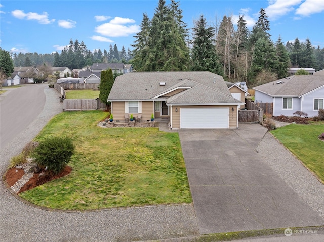 single story home featuring a front lawn and a garage