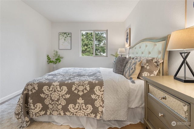 bedroom with light carpet