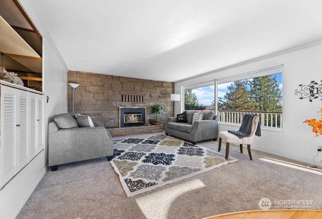 carpeted living room featuring a fireplace