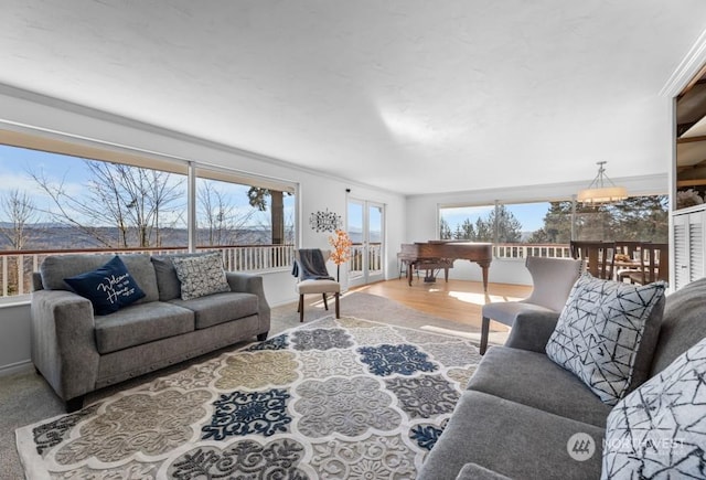 living room featuring hardwood / wood-style flooring and ornamental molding