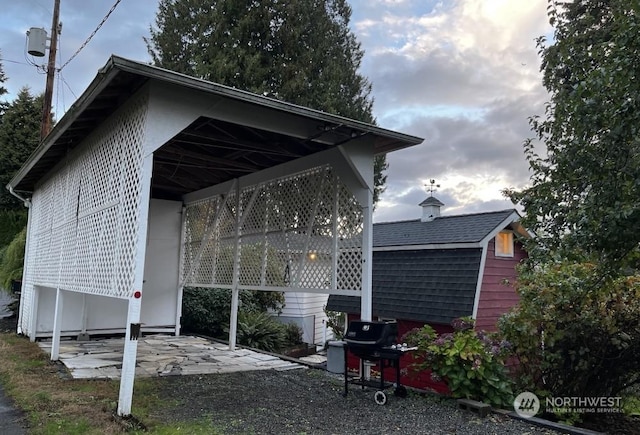 view of home's exterior with a carport