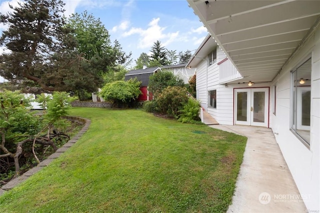 view of yard with french doors