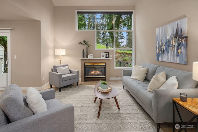 living room featuring a wealth of natural light and a fireplace