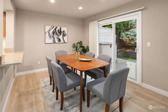 dining space featuring light hardwood / wood-style floors