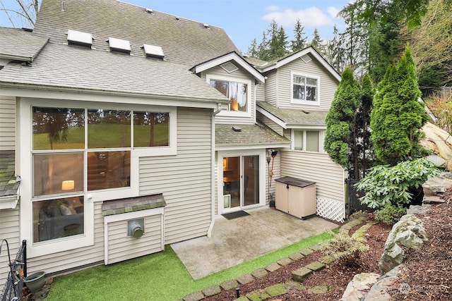 back of house with a patio