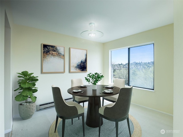 dining room with light colored carpet and a baseboard heating unit