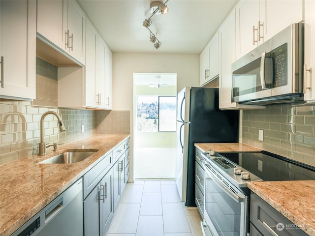 kitchen with white cabinets, sink, and stainless steel appliances