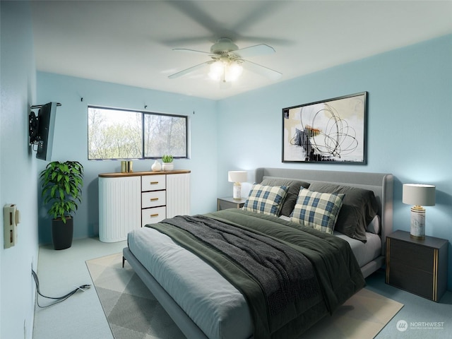 bedroom with ceiling fan and light carpet