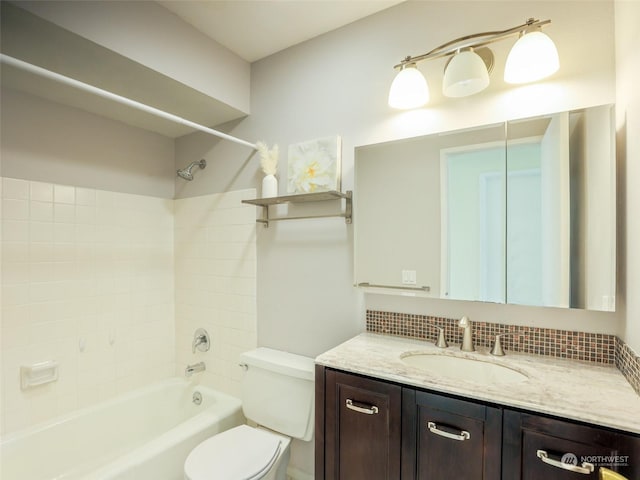 full bathroom featuring backsplash, vanity, bathtub / shower combination, and toilet