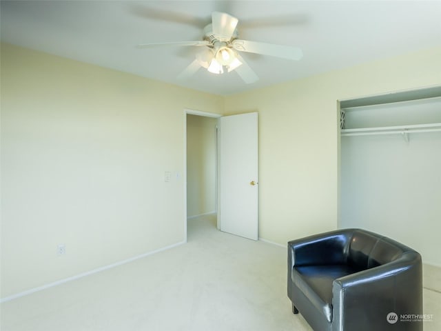 unfurnished room featuring light colored carpet and ceiling fan