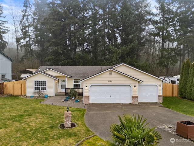 single story home with a garage and a front lawn