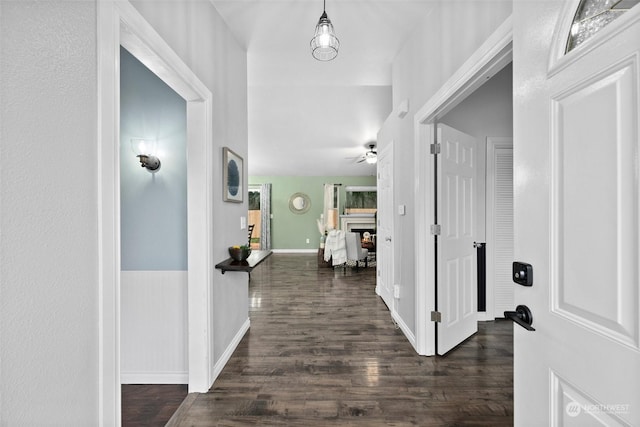 corridor featuring dark hardwood / wood-style flooring