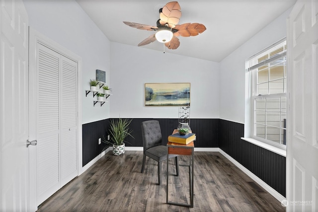 home office featuring lofted ceiling, ceiling fan, and dark hardwood / wood-style flooring