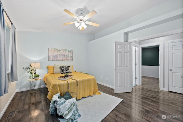 bedroom with ceiling fan and dark hardwood / wood-style floors